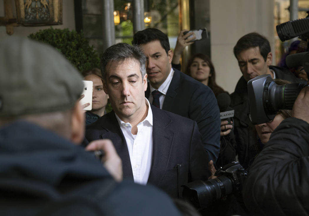 Michael Cohen, former attorney to President Donald Trump, leaves his apartment building before ...