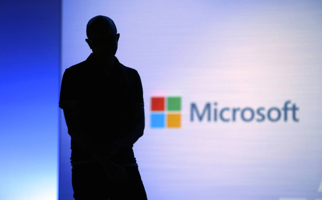 FILE- In this May 7, 2018, file photo Microsoft CEO Satya Nadella looks on during a video as he ...