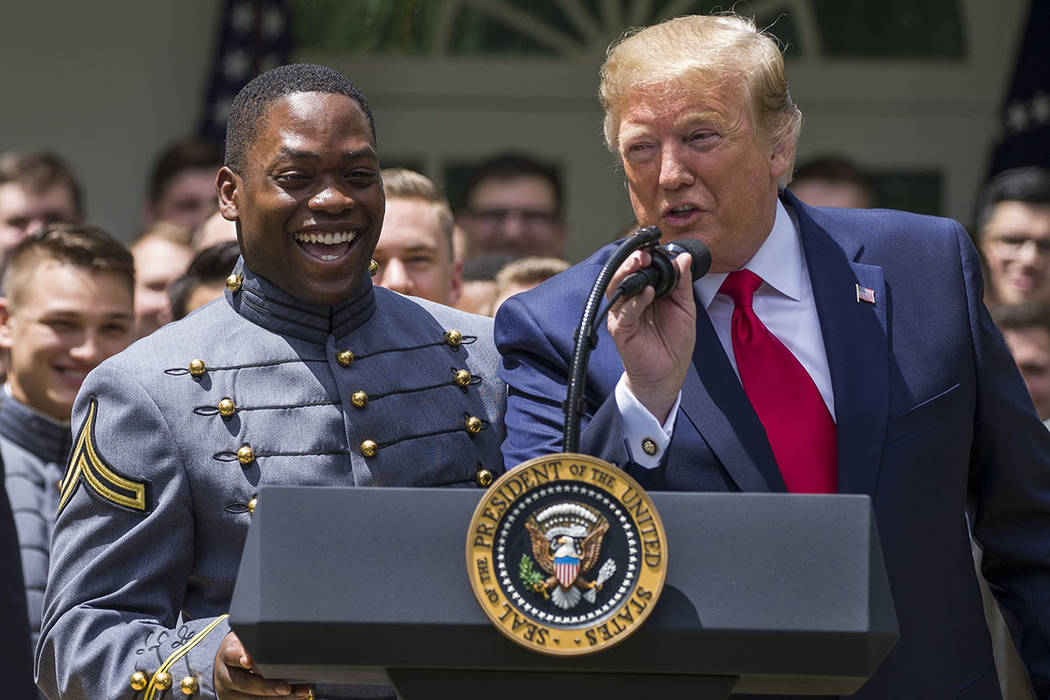 President Donald Trump speaks to introduce Army quarterback Kelvin Hopkins Jr., during the pres ...