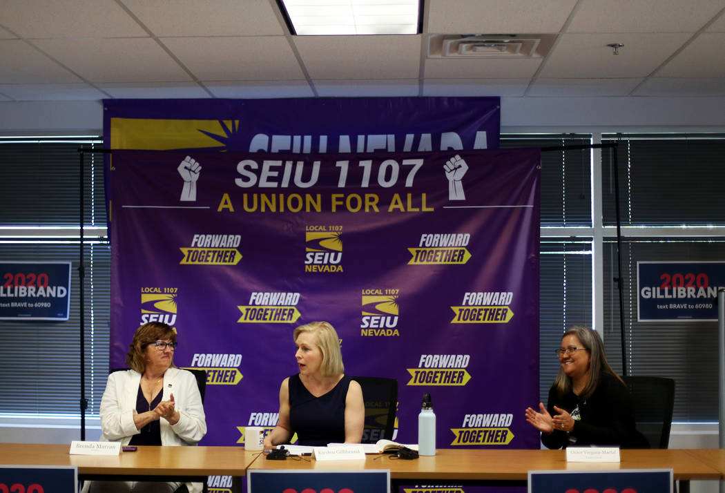 Democratic presidential candidate Sen. Kirsten Gillibrand, center, is applauded by SEIU Local 1 ...