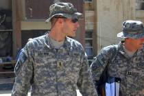 1st Lt. Michael C. Behenna, left, and his defense attorney Capt. Tom Clark, right, walk in Cam ...