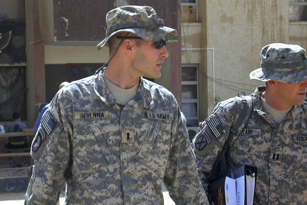 1st Lt. Michael C. Behenna, left, and his defense attorney Capt. Tom Clark, right, walk in Cam ...