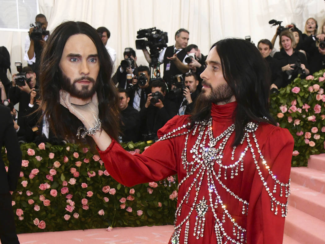 Jared Leto, holding a model of his own head, attends The Metropolitan Museum of Art's Costume I ...