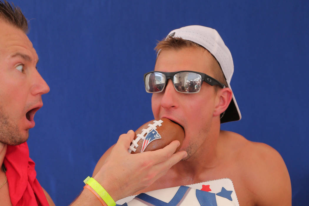 Ex-New England Patriots tight end Rob Gronkowski devours a celebratory retirement cake at Jemma ...