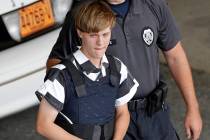 Shooting suspect Dylann Roof is escorted June 18, 2015, from the Cleveland County Courthouse in ...