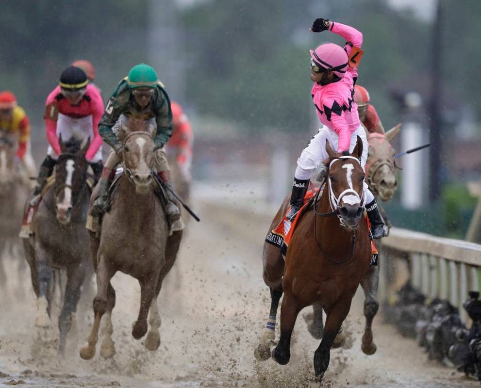 Luis Saez rides Maximum Security across the finish line first during the 145th running of the K ...