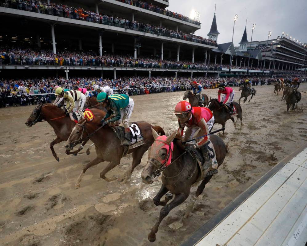 Flavien Prat ride Country House, left, to the finish line during the 145th running of the Kentu ...