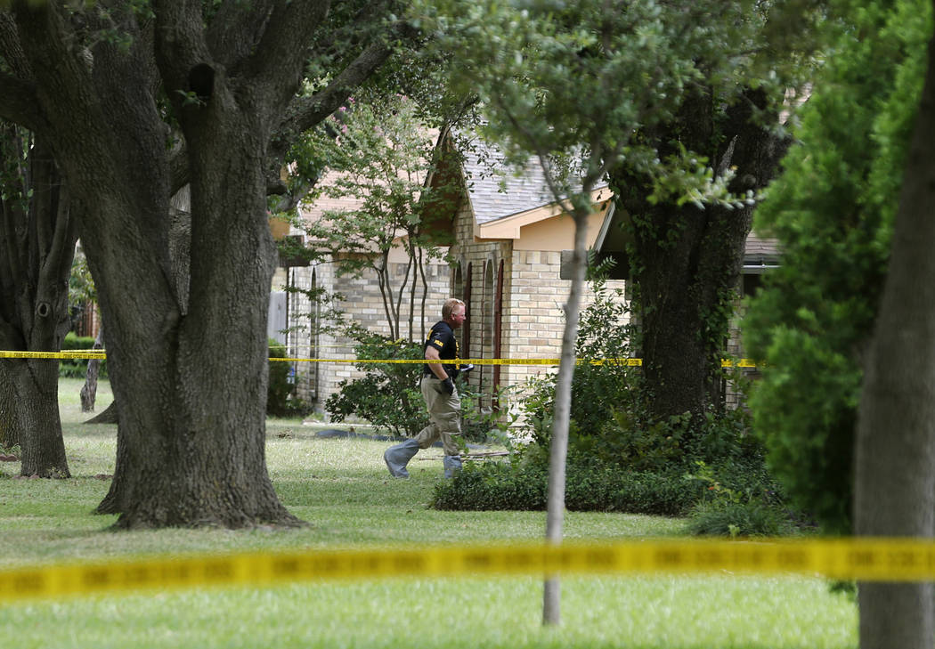 FILE - In this Sept. 12, 2017, file photo, police investigate at the scene of a shooting on Wes ...