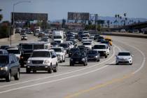 In this Saturday, May 16, 2015 photo, a car travels along one of the "ExpressLanes" to avoid he ...