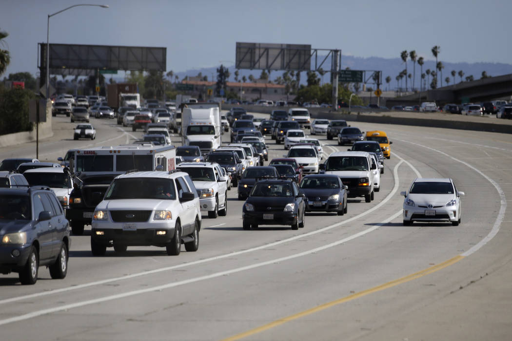 In this Saturday, May 16, 2015 photo, a car travels along one of the "ExpressLanes" to avoid he ...