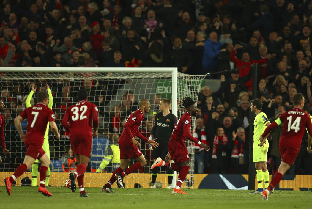 Liverpool's Divock Origi celebrates scoring his side's 4th goal during the Champions League sem ...