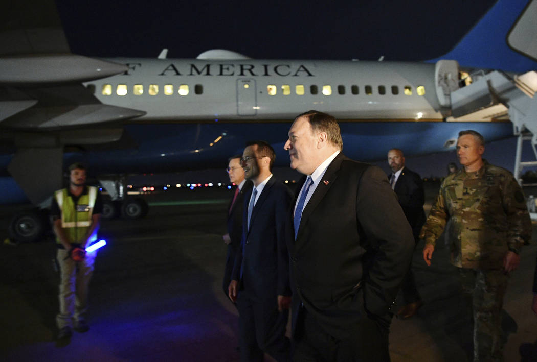 U.S. Secretary of State Mike Pompeo, center, walks with Acting Assistant Secretary for Near Eas ...