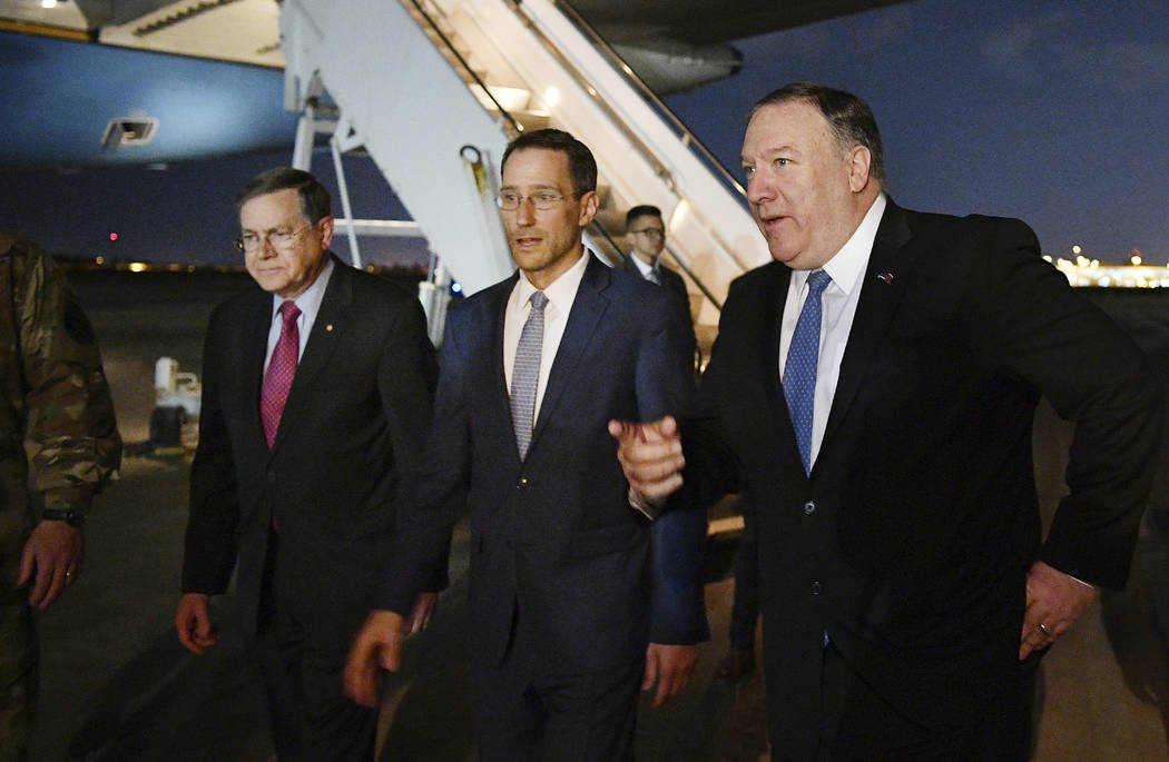 Secretary of State Mike Pompeo, right walks with Acting Assistant Secretary for Near Eastern Af ...