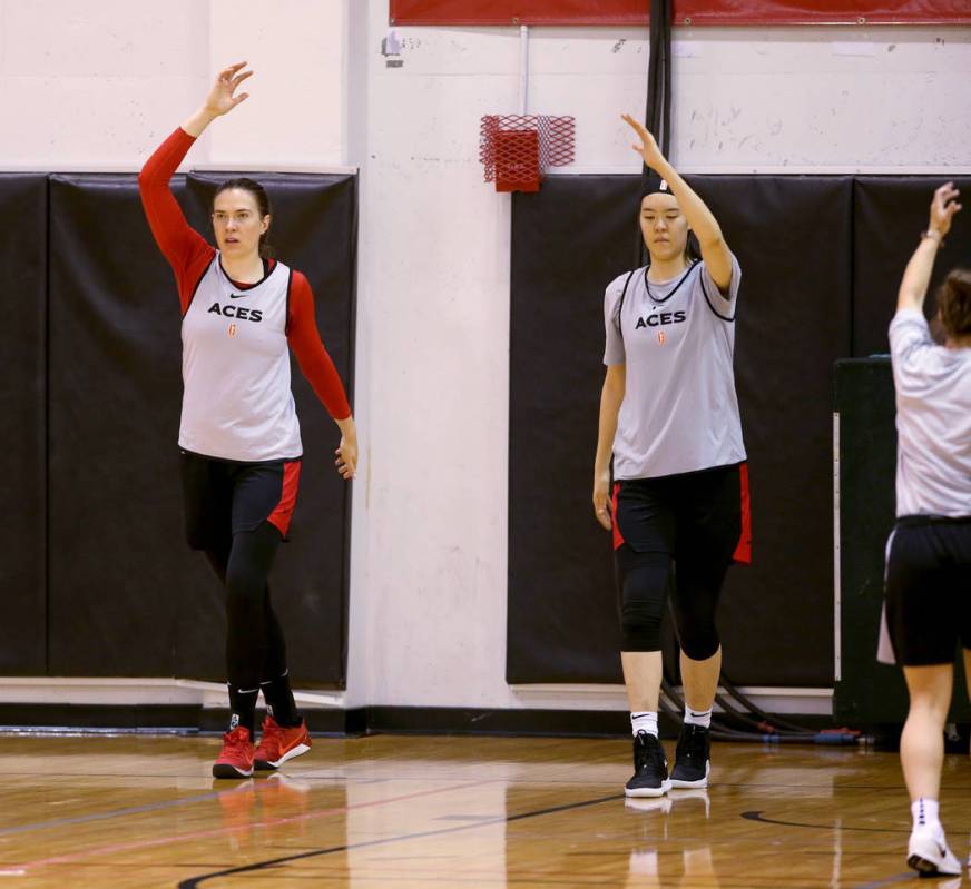 Aces center Ruth Hamblin, left, warms up with teammate JiSu Park during practice at Cox Pavilio ...