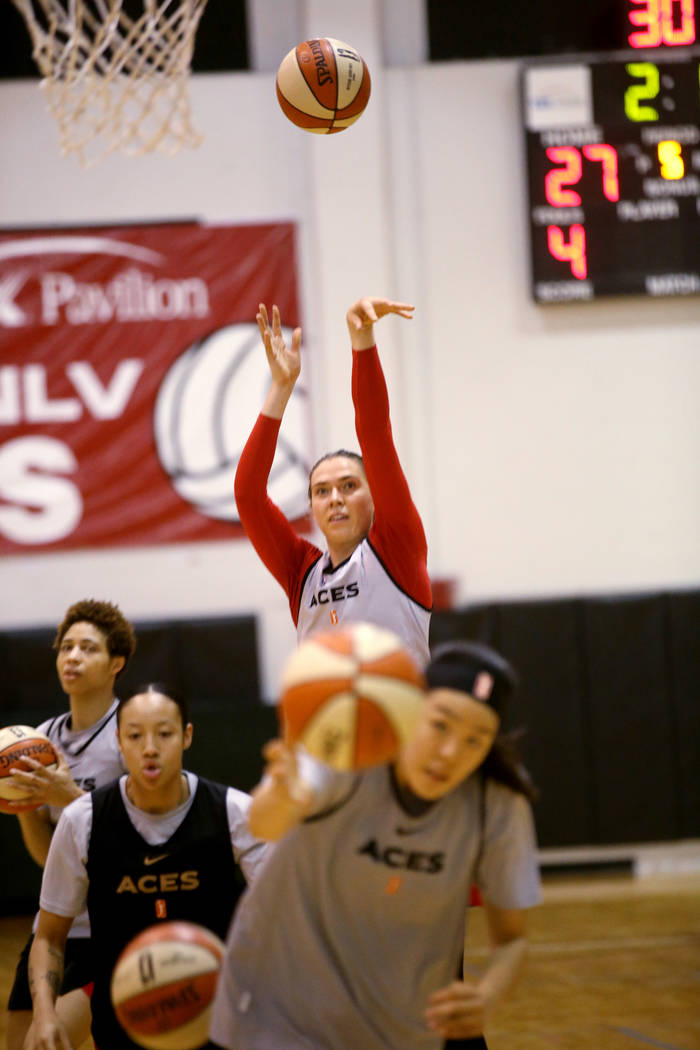 Aces center Ruth Hamblin, left, shoots with teammates during practice at Cox Pavilion in Las Ve ...