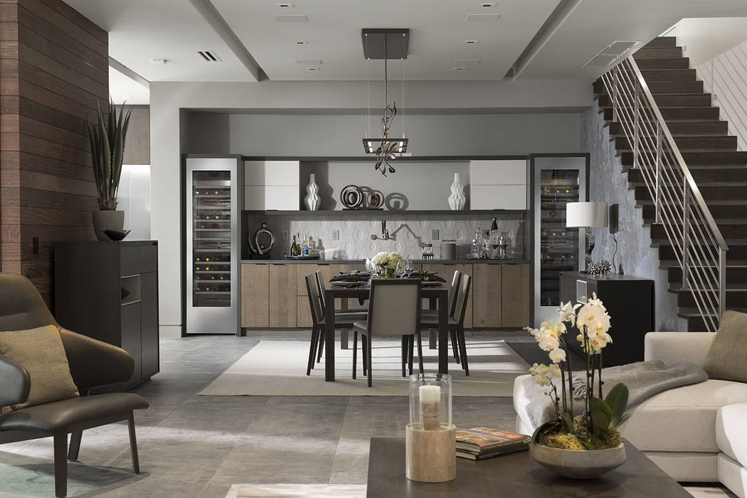 The dining room has wine cabinets and a warm setting. (Studio G Architecture)