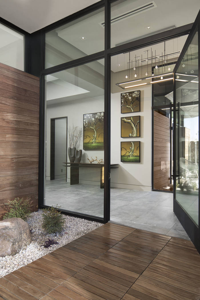 The front door opens to luxury that is reminiscent to Australian modern architecture. (Studio G ...