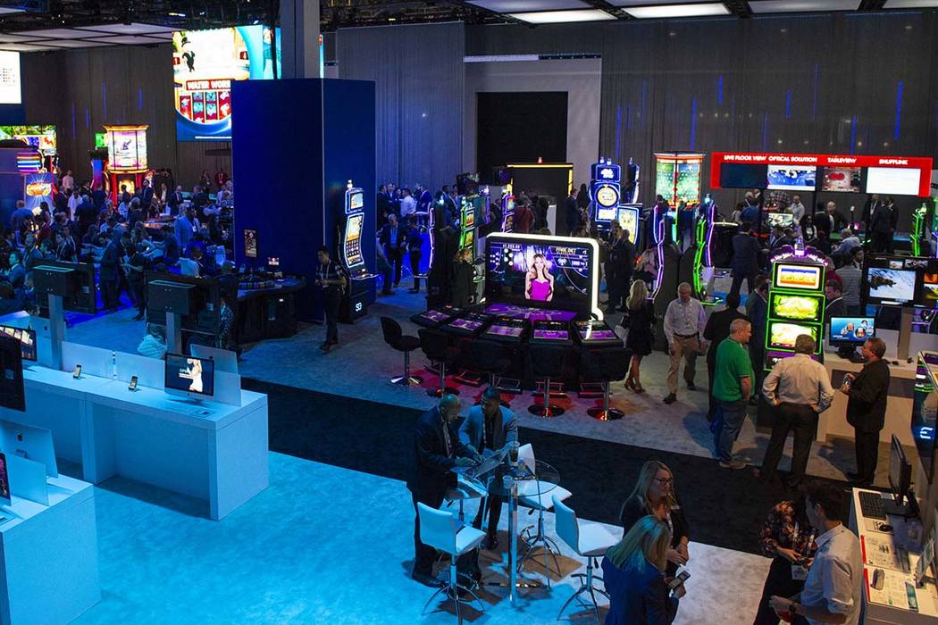 Scientific Games showcases their new games and technology behind a wall surrounding the booth t ...