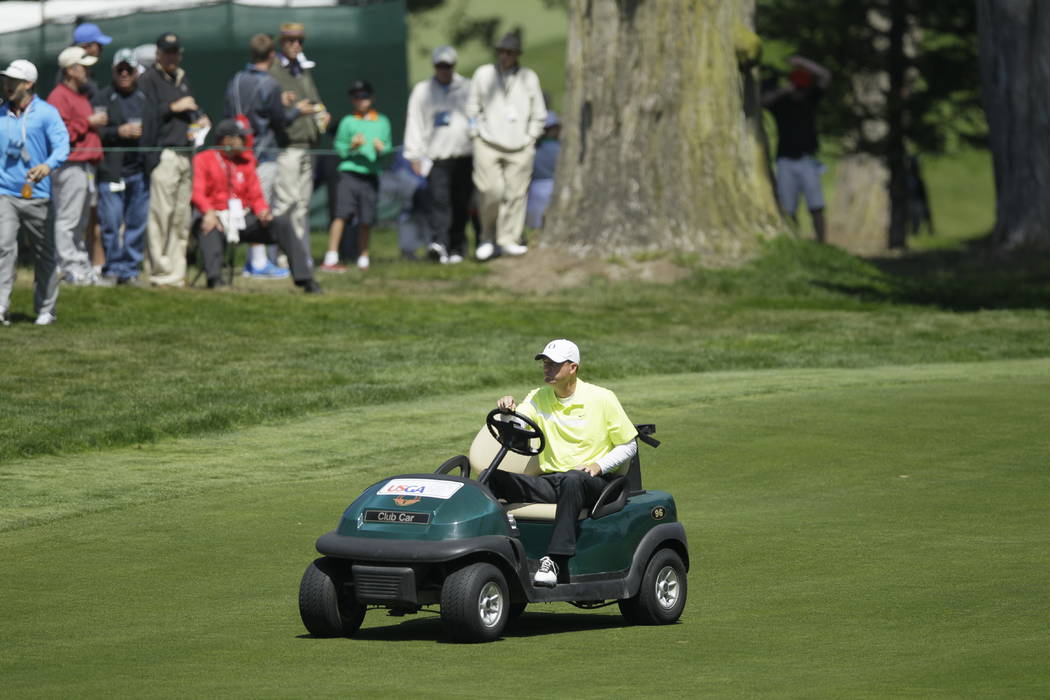 FILE - In this June 15, 2012, file photo, Casey Martin drives to the fifth green during the sec ...