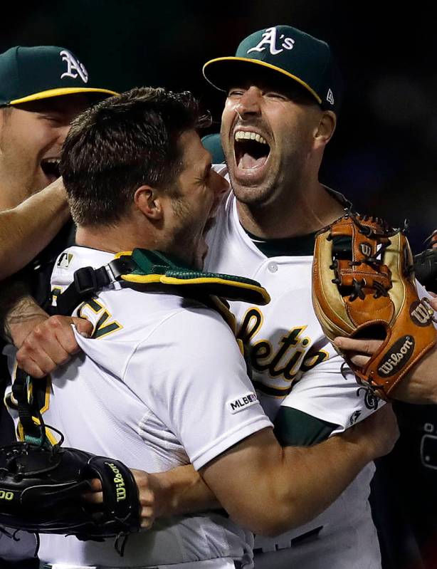 Oakland Athletics' Mike Fiers, right, embraces catcher Josh Phegley after pitching a no hitter ...