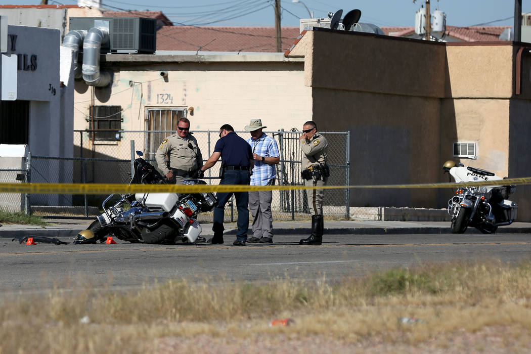 A Las Vegas motorcycle officer suffered minor injuries when a driver he had stopped for a traff ...