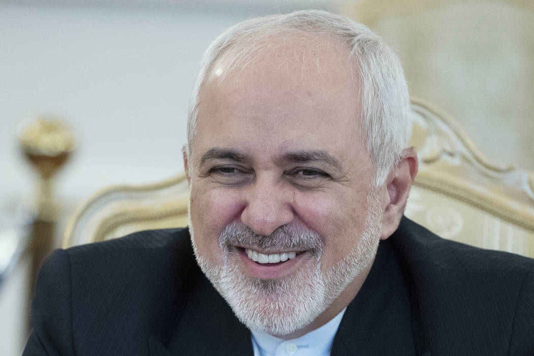 Iranian Foreign Minister Mohammad Javad Zarif smiles during his meeting with Russian Foreign Mi ...