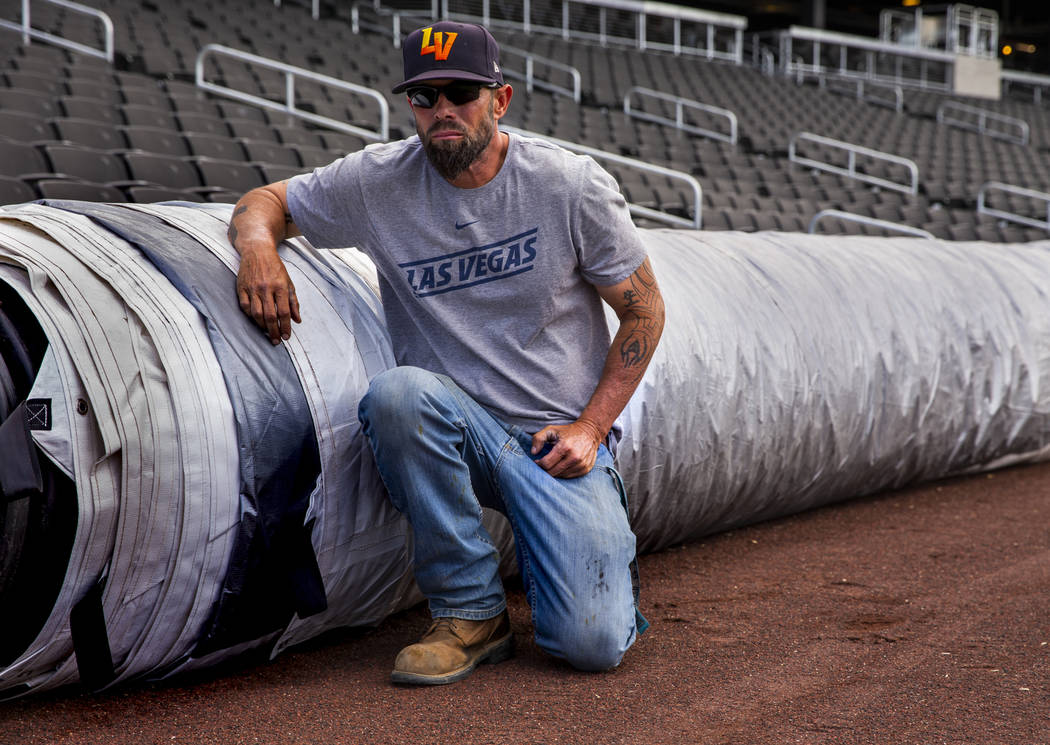 The Aviators head groundskeeper Collin Doebler with their new field tarp at Las Vegas Ballpark, ...