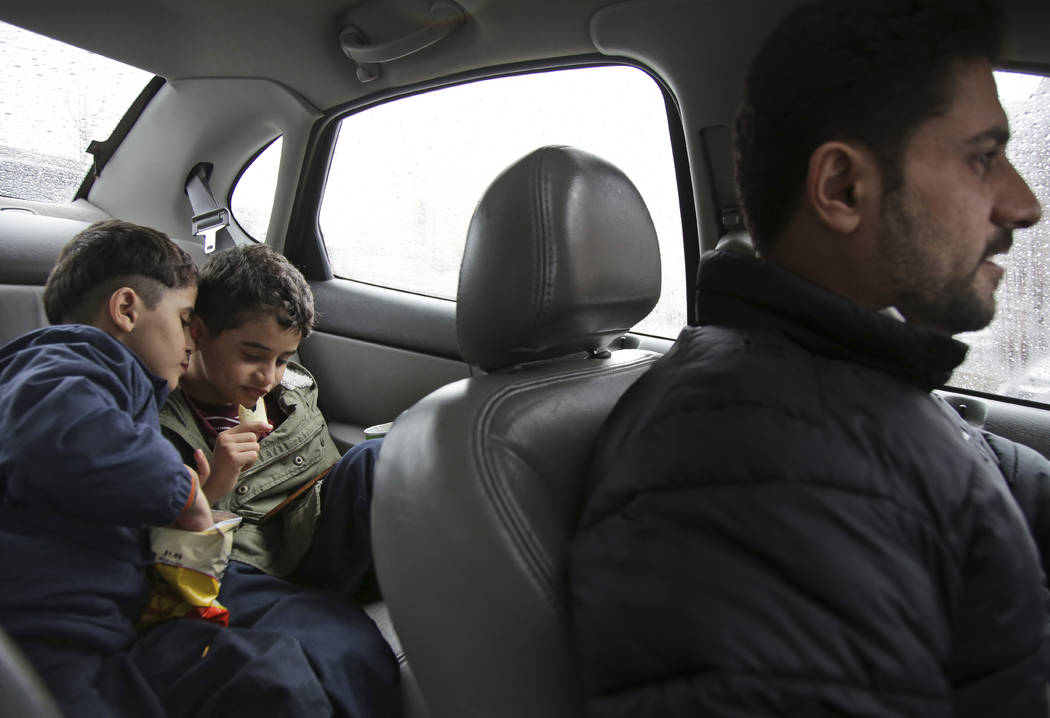 In this Thursday, March 21, 2019, photo, brothers Adel Ahmed, 9, center, and Mutaz Ahmed, 7, vi ...