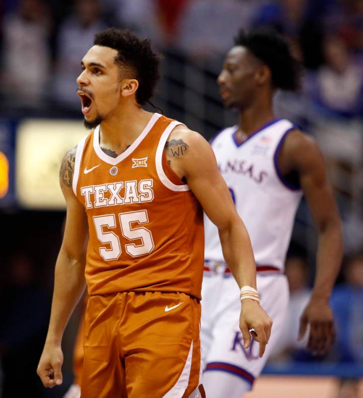 Texas guard Elijah Mitrou-Long (55) celebrates after making a basket during the first half of a ...