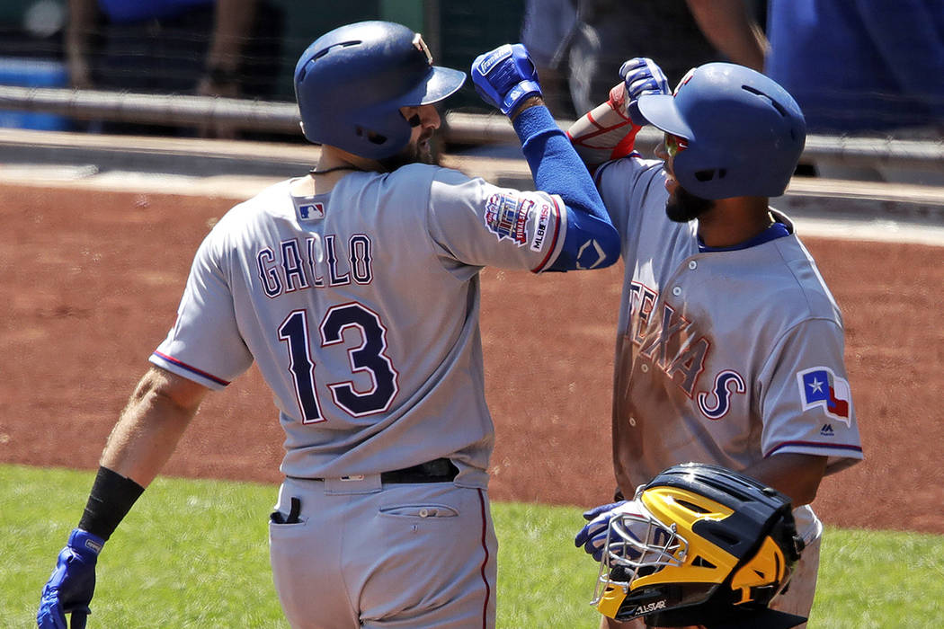 Texas Rangers' Joey Gallo (13) celebrates with Elvis Andrus after hitting a two-run home run of ...