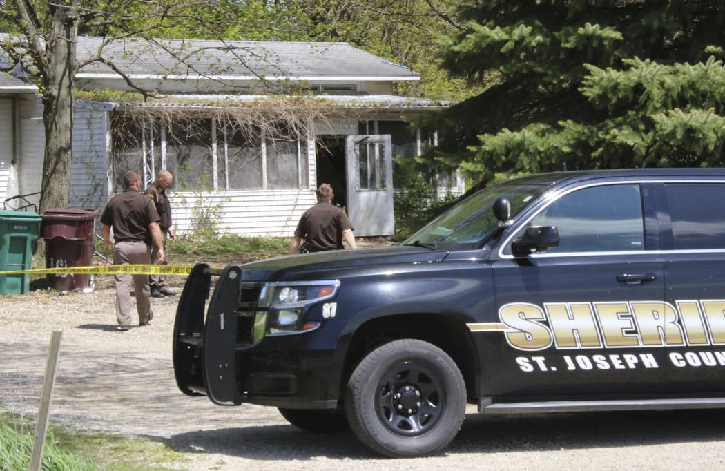 In this Monday, May 6, 2019 photo, St. Joseph County Sheriff deputies stand outside the site wh ...