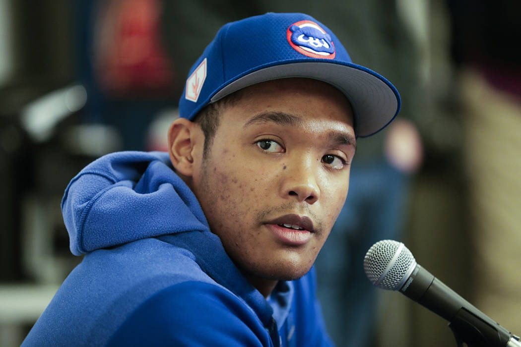 FILE - In this Friday, Feb. 15, 2019, file photo, Chicago Cubs shortstop Addison Russell speaks ...