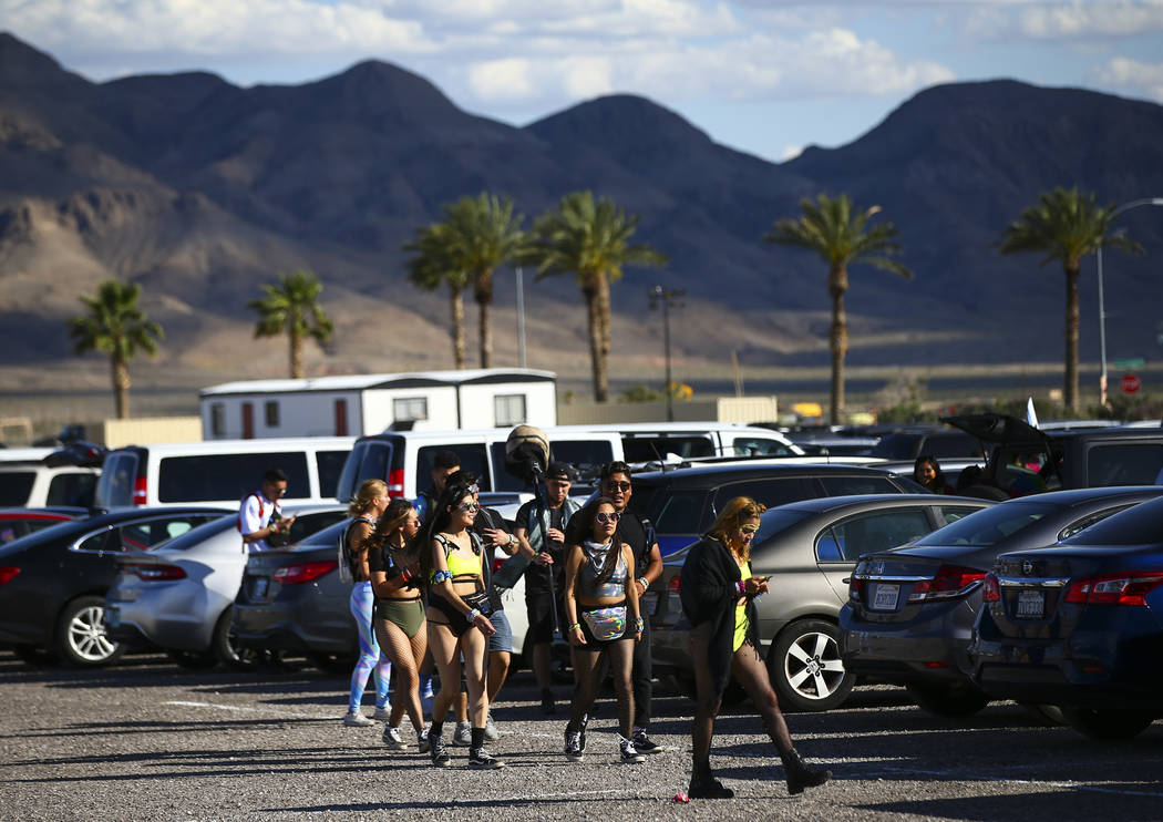 Electric Daisy Carnival attendees make their way to the Las Vegas Motor Speedway in Las Vegas o ...