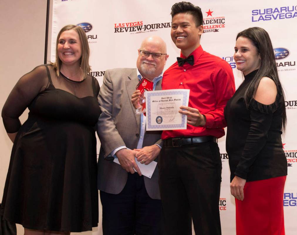 Award winner Shaun Mabanta, third from left, a twelfth grader at Liberty High School, poses for ...