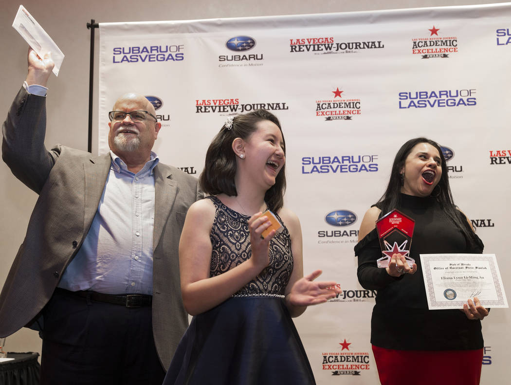 Award winner Eliana Lynn Li-Ming Au, middle, a sixth grader at Bob Miller Middle School, celebr ...