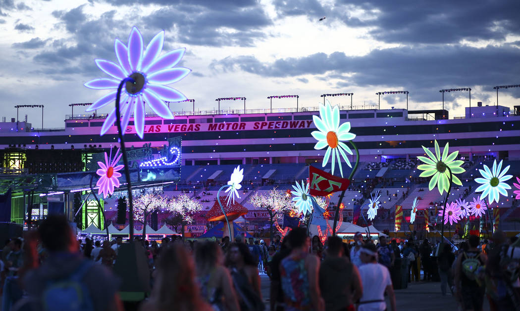 Attendees crowd the festival grounds as the third day of the Electric Daisy Carnival kicks off ...