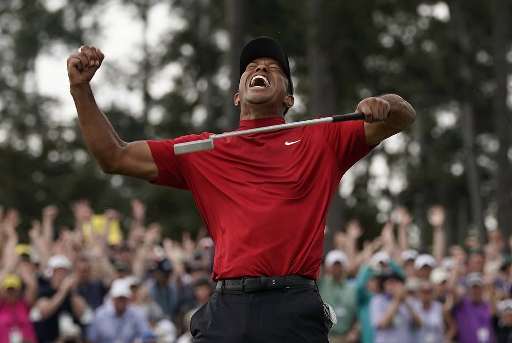 Tiger Woods reacts as he wins the Masters golf tournament Sunday, April 14, 2019, in Augusta, G ...