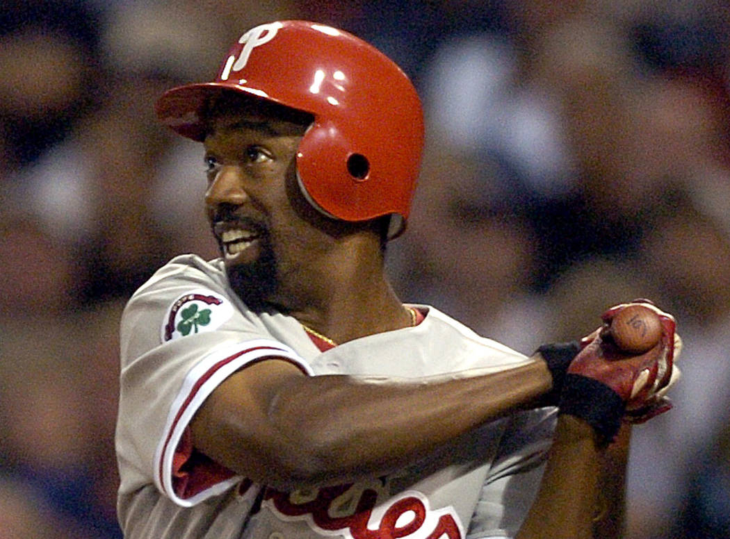 FILE - In this Aug. 4, 2004, file photo, Philadelphia Phillies' Doug Glanville follows through ...