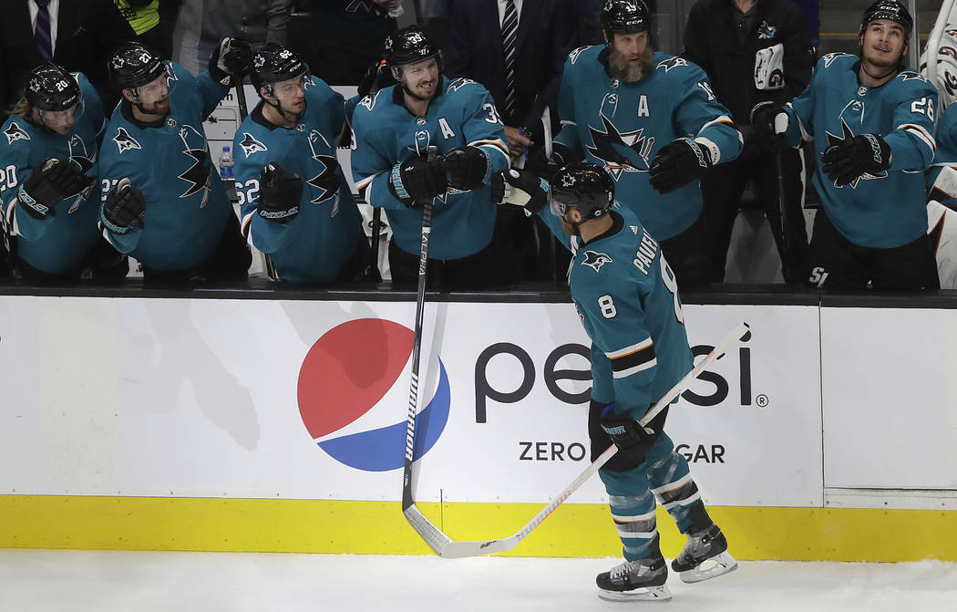 San Jose Sharks center Joe Pavelski (8) is congratulated by teammates after scoring a goal agai ...