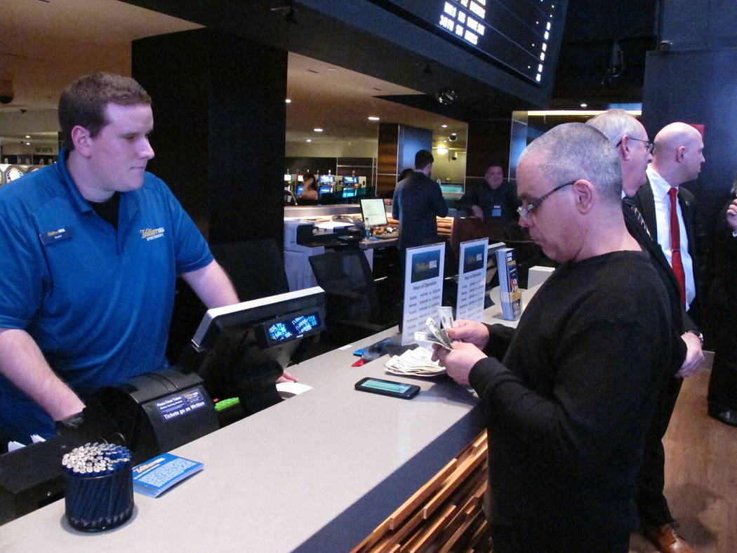 This March 8, 2019 photo shows a gambler making a sports bet at the Tropicana casino in Atlanti ...