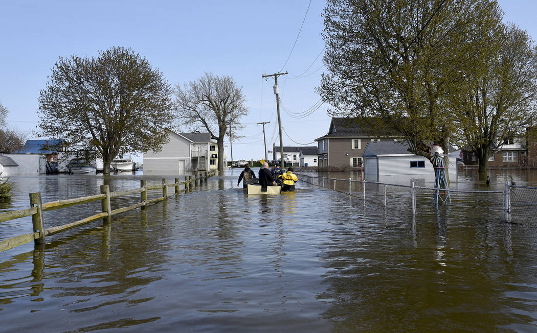 In this Wednesday, May 8, 2019 photo, Estral Beach Firefighters Courtney Millar, right, Eric Br ...