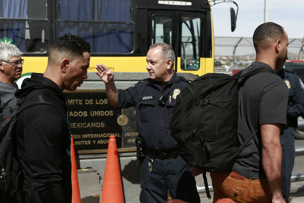 Cuban migrant are escorted by Mexican immigration officials in Ciudad Juarez, Mexico, on April ...