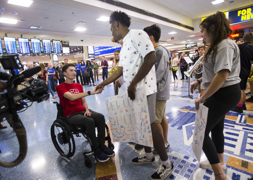 Faith Lutheran senior Mark Wilbourne, left, greets David Heckard during a welcome party at McCa ...