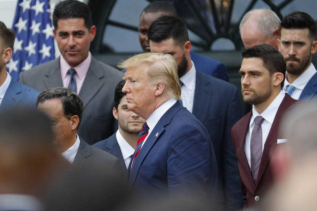 President Donald Trump leaves the stage after speaking during a ceremony on the South Lawn of t ...