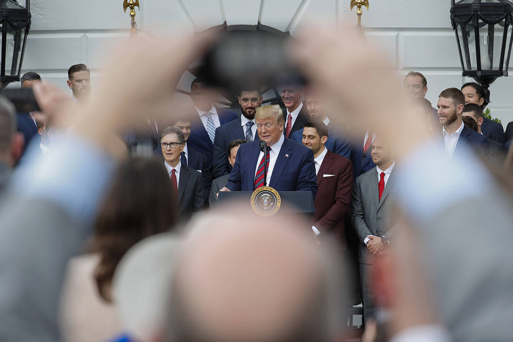 President Donald Trump, center, speaks during a ceremony on the South Lawn of the White House i ...