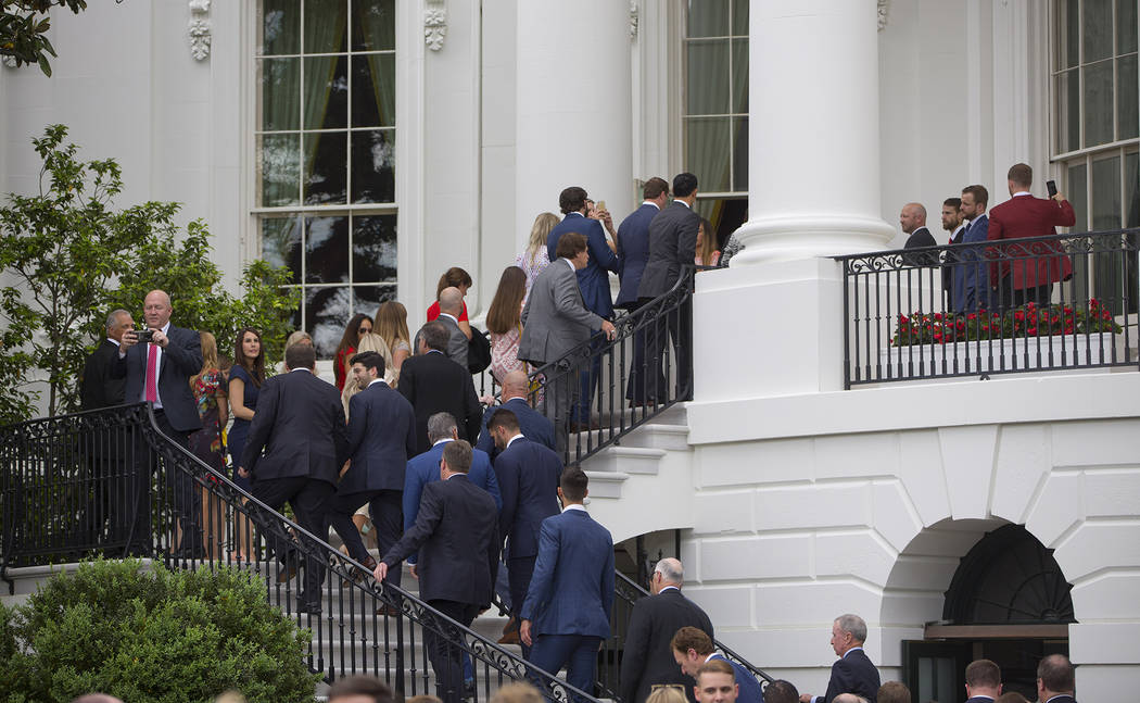 Members of the Boston Red Sox organization make their way up stairs of the White House in Washi ...