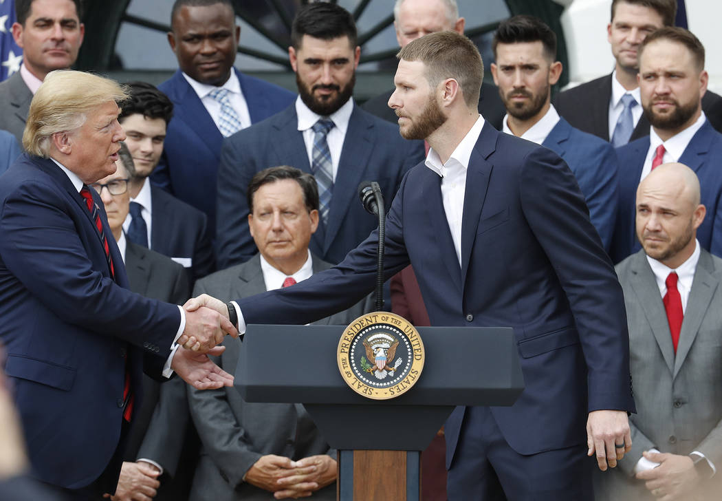 President Donald Trump, left, shakes hands with Boston Red Sox pitcher Chris Sale, right, durin ...