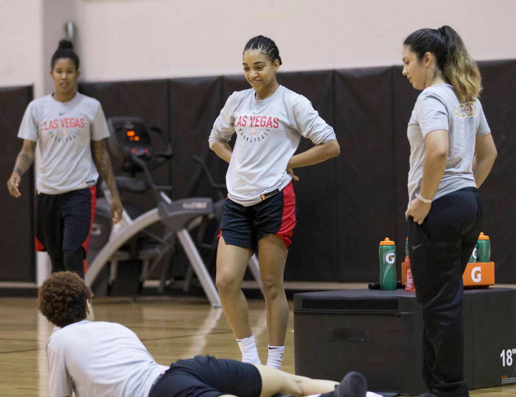 Dominique Wilson, middle, talks with Aces players after practice on Friday, May 10, 2019, at Co ...