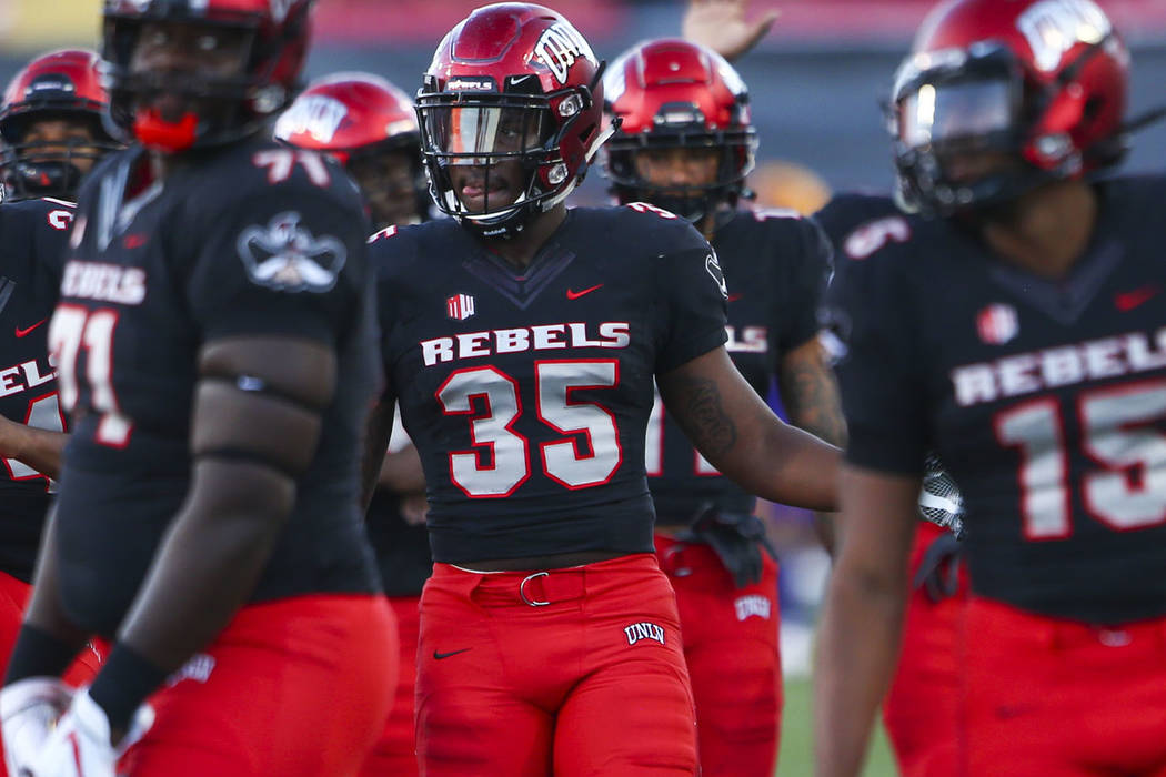 UNLV players warm up before a football game against Prairie View A&M Panthers at Sam Boyd Stadi ...