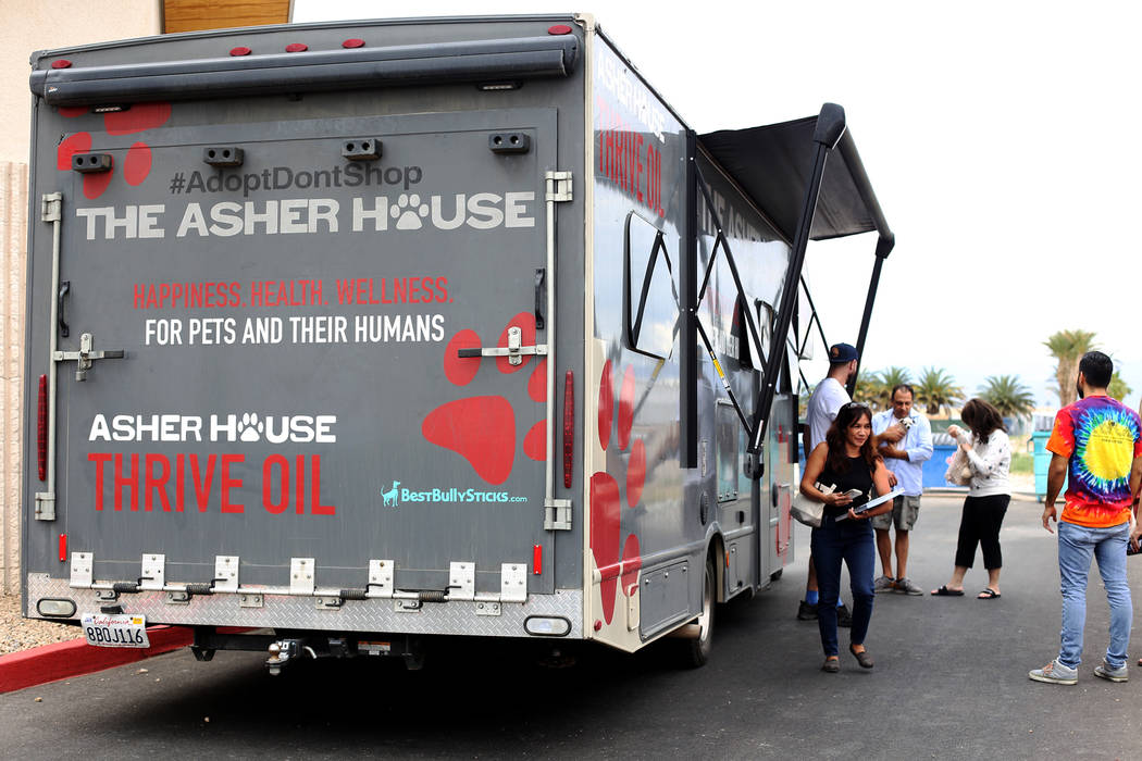 Lee Asher talks to fans outside The Asher House RV in the parking lot of Nevada Society for the ...